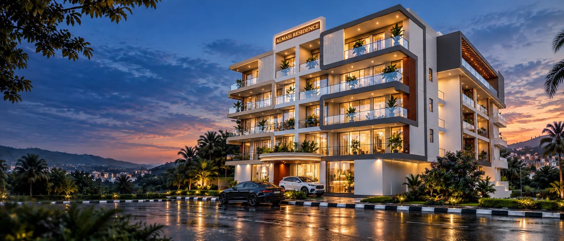 Almasi Residence at dusk, seen from the street corner: five storeys of lit, glass-fronted apartments with planted balconies above a street-level lobby, against an evening sky